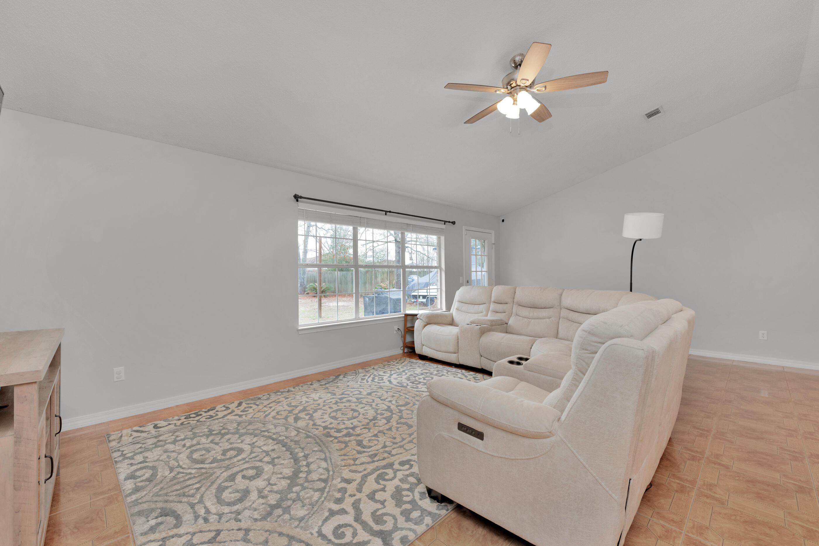 2831 Atoka Trail Crestview, FL 32539 - Photo 12 of 27 a living room with furniture and a large window