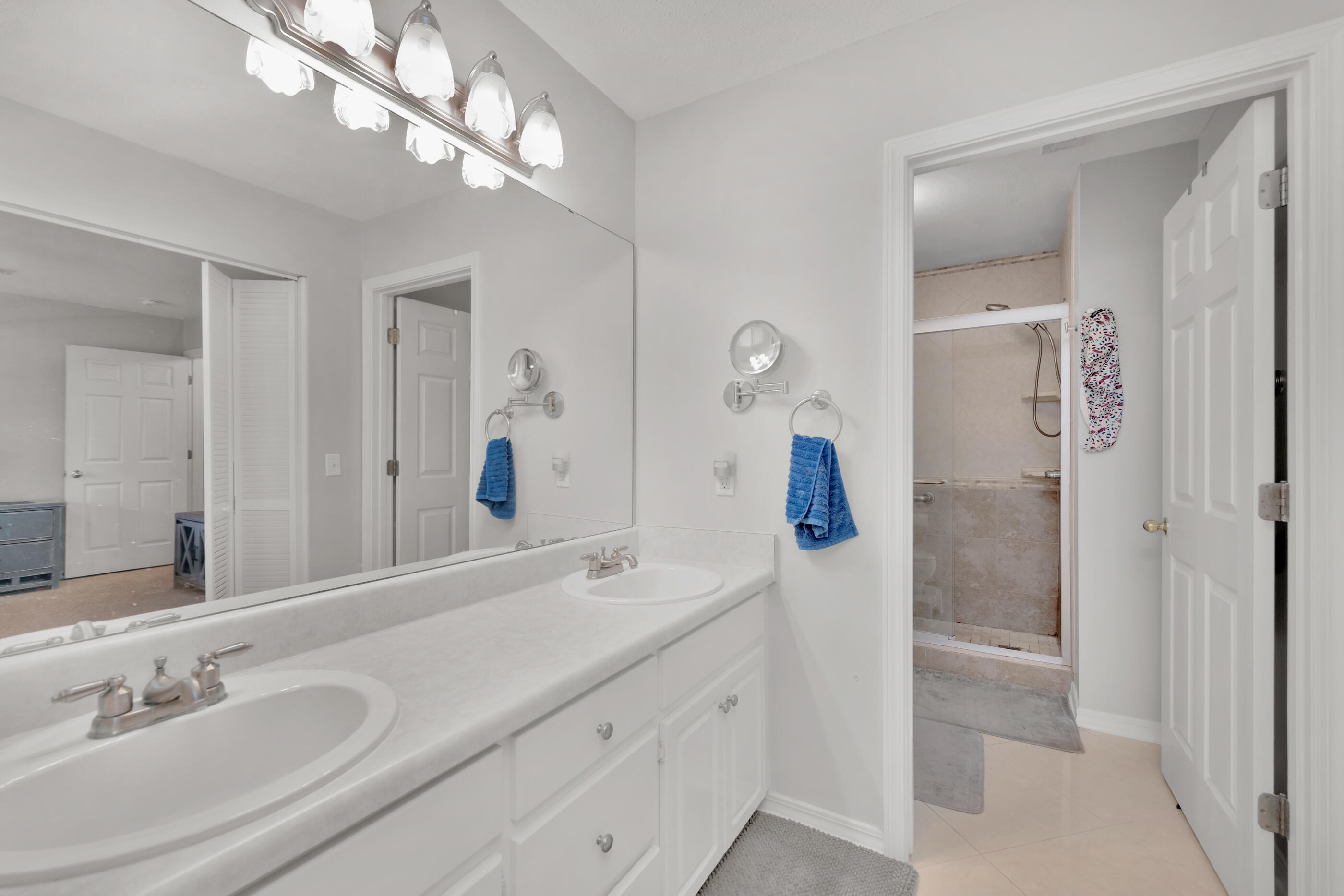 2831 Atoka Trail Crestview, FL 32539 - Photo 15 of 27 a bathroom with a double vanity sink and a mirror