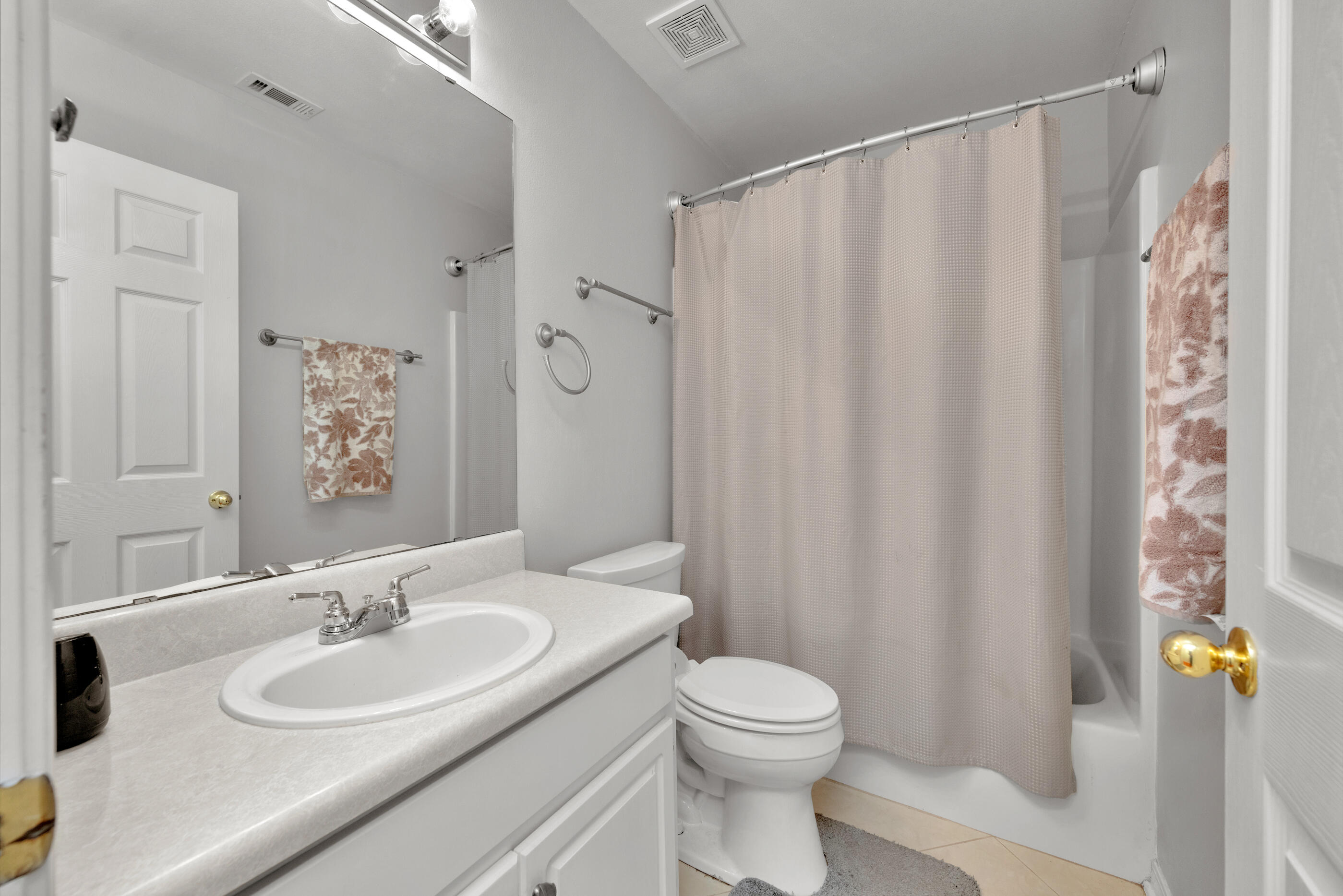 2831 Atoka Trail Crestview, FL 32539 - Photo 19 of 27 a bathroom with a sink and a mirror