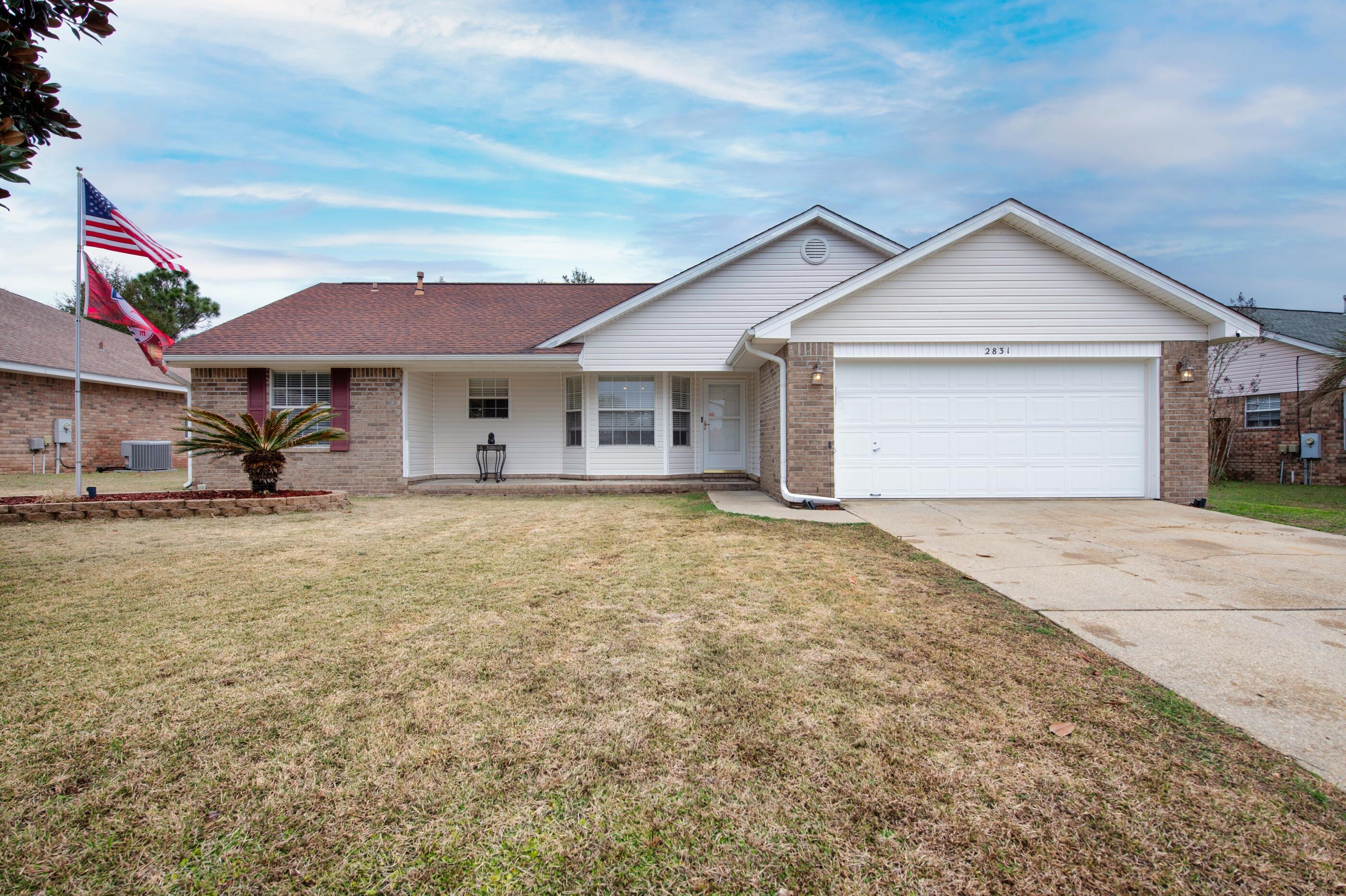 2831 Atoka Trail Crestview, FL 32539 - Photo 2 of 27 a front view of a house with yard