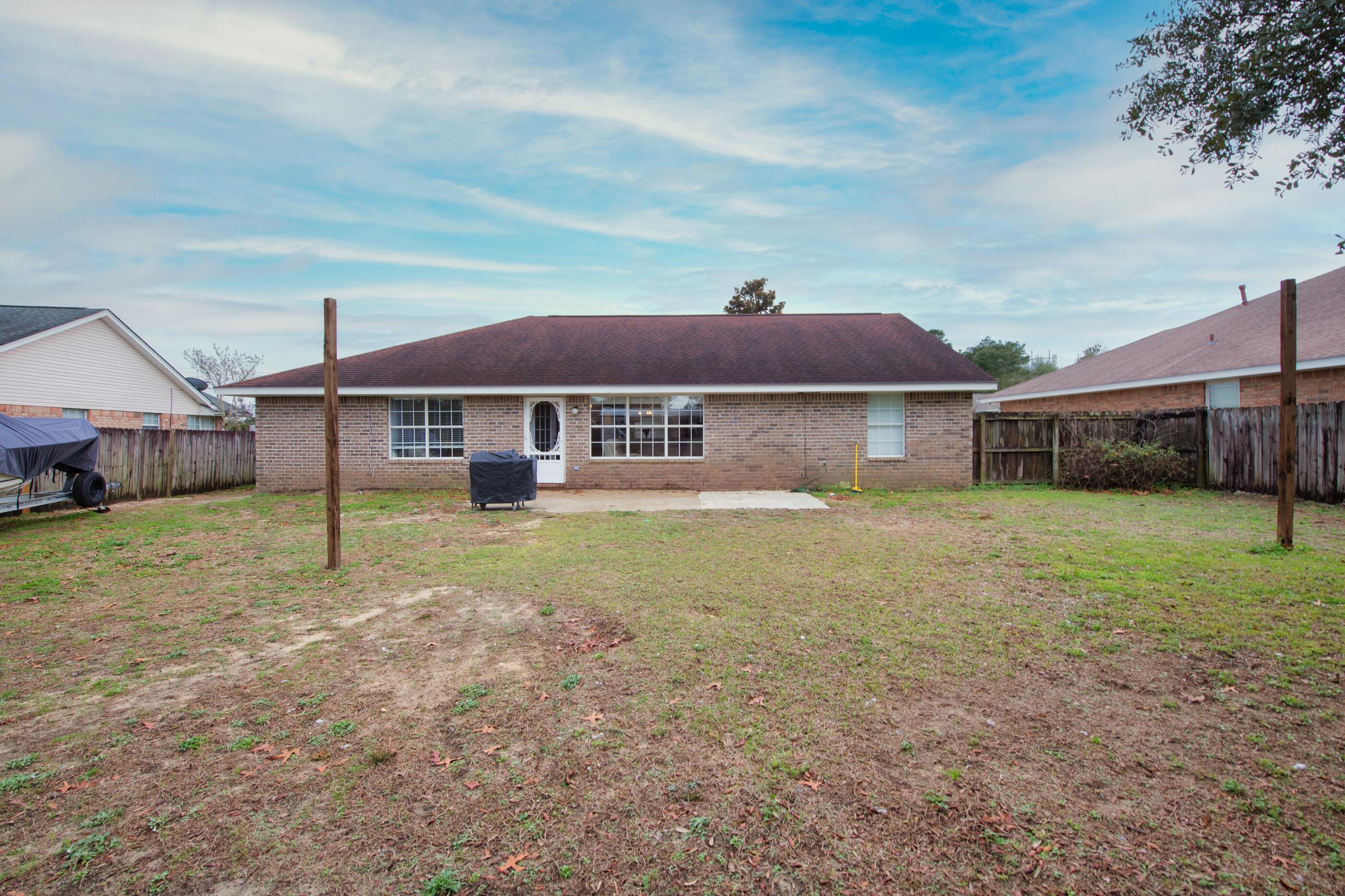 2831 Atoka Trail Crestview, FL 32539 - Photo 22 of 27 a front view of a house with a yard