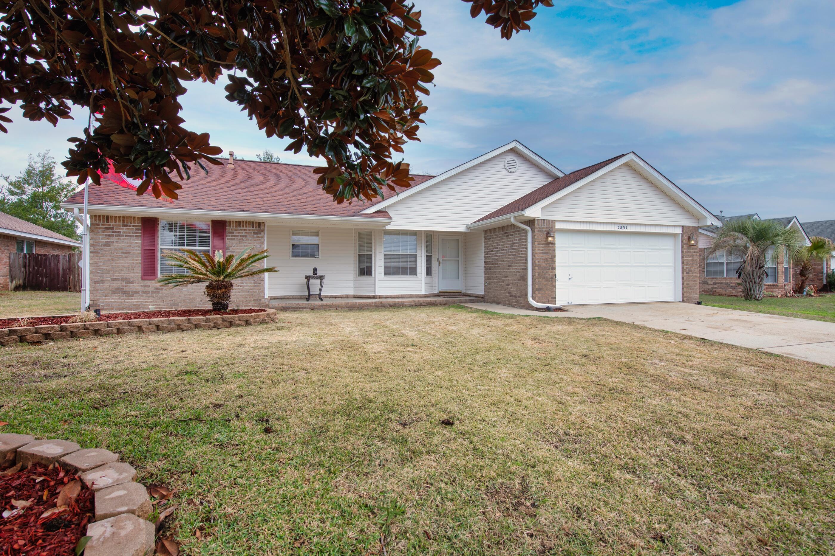 2831 Atoka Trail Crestview, FL 32539 - Photo 4 of 27 front view of a house with a yard
