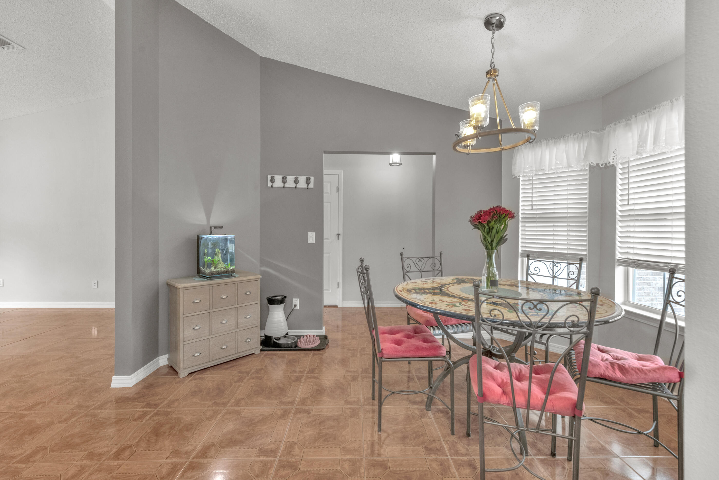 2831 Atoka Trail Crestview, FL 32539 - Photo 5 of 27 a view of a dining room with furniture and chandelier