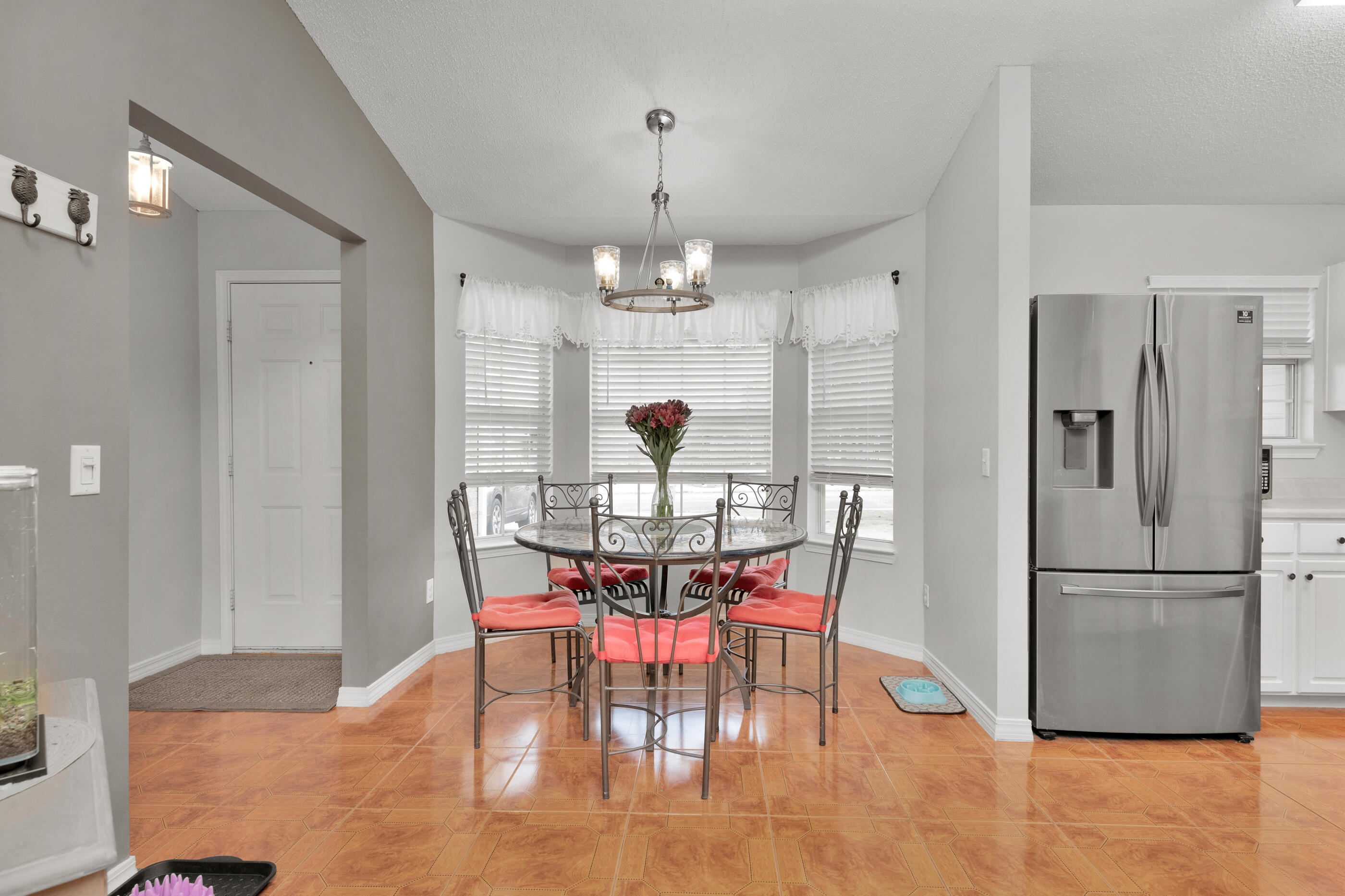2831 Atoka Trail Crestview, FL 32539 - Photo 6 of 27 a dining room with furniture a chandelier and window