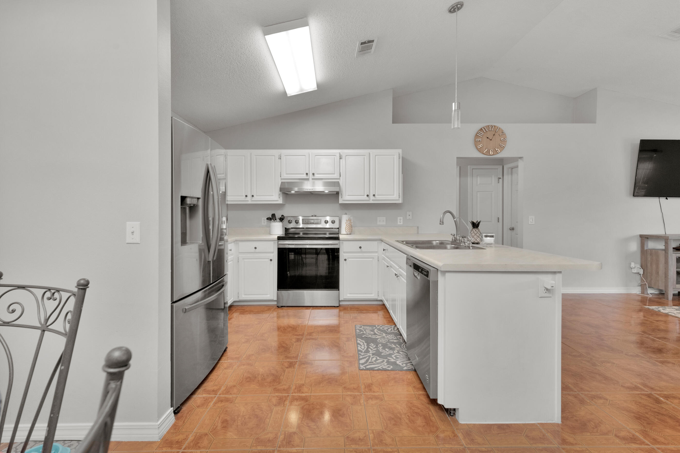 2831 Atoka Trail Crestview, FL 32539 - Photo 8 of 27 a kitchen with stainless steel appliances granite countertop a sink stove and refrigerator