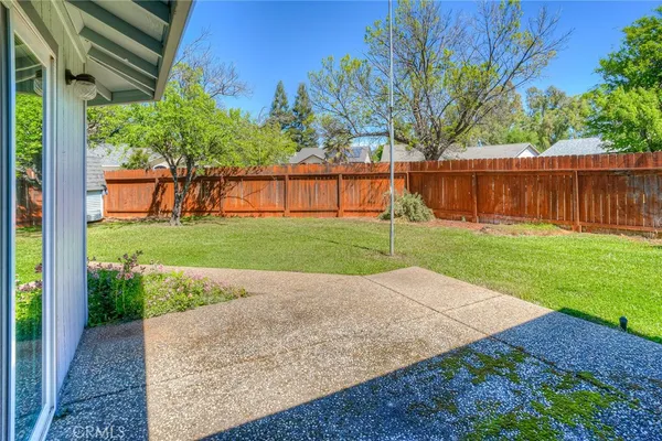 a view of a backyard with green space