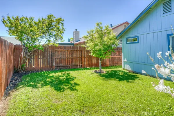 a backyard of a house with lots of green space