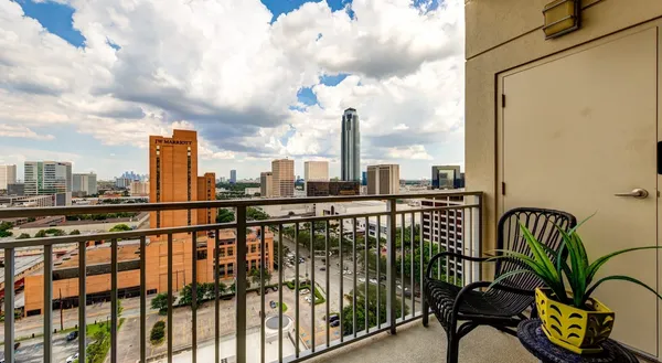a view of balcony with furniture