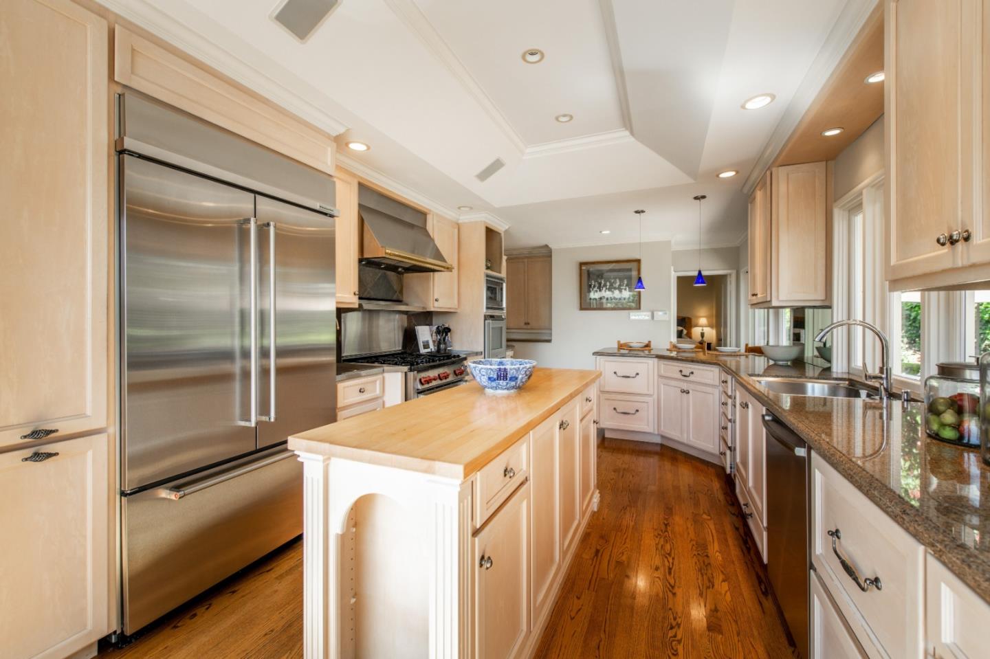835 Longview Road Hillsborough, CA 94010 - Photo 11 of 31 a kitchen with a refrigerator a sink and a stove top oven