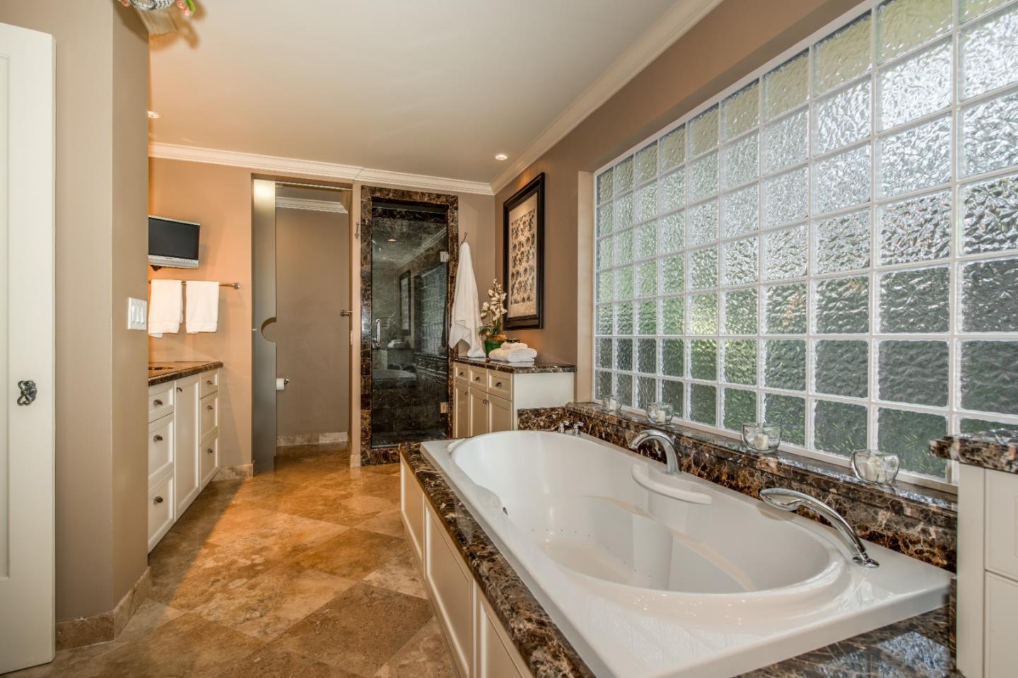 835 Longview Road Hillsborough, CA 94010 - Photo 18 of 31 a spacious bathroom with a tub and a shower
