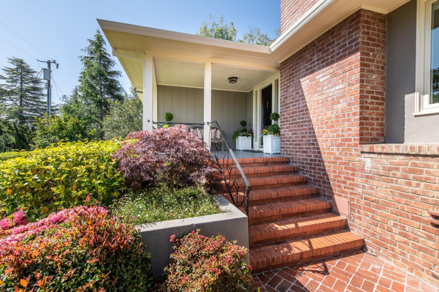 835 Longview Road Hillsborough, CA 94010 - Photo 2 of 31 a front view of a house with plants