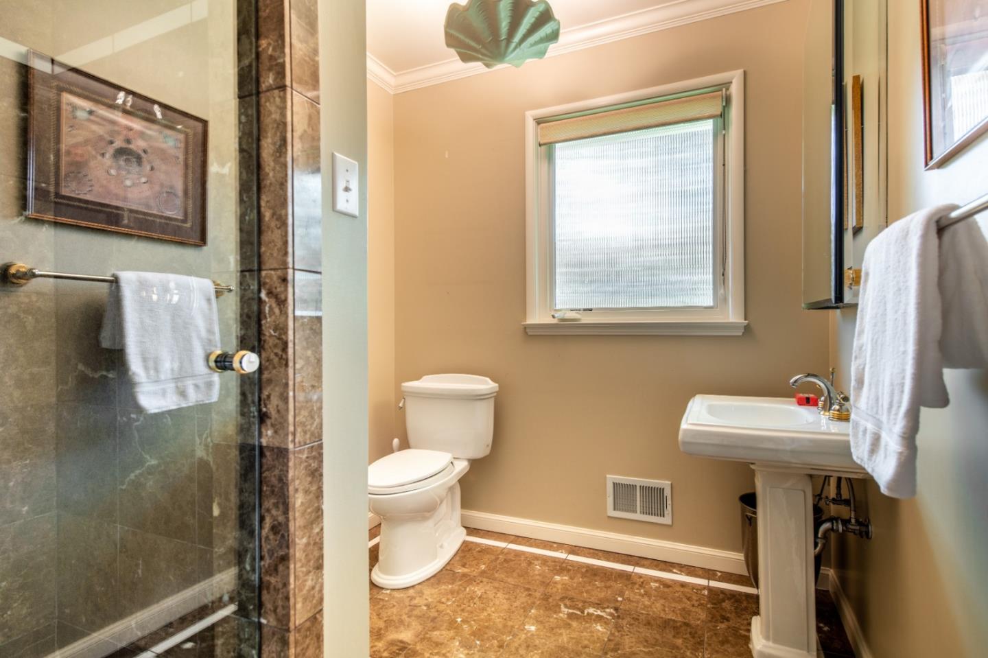 835 Longview Road Hillsborough, CA 94010 - Photo 21 of 31 a bathroom with a sink toilet and shower