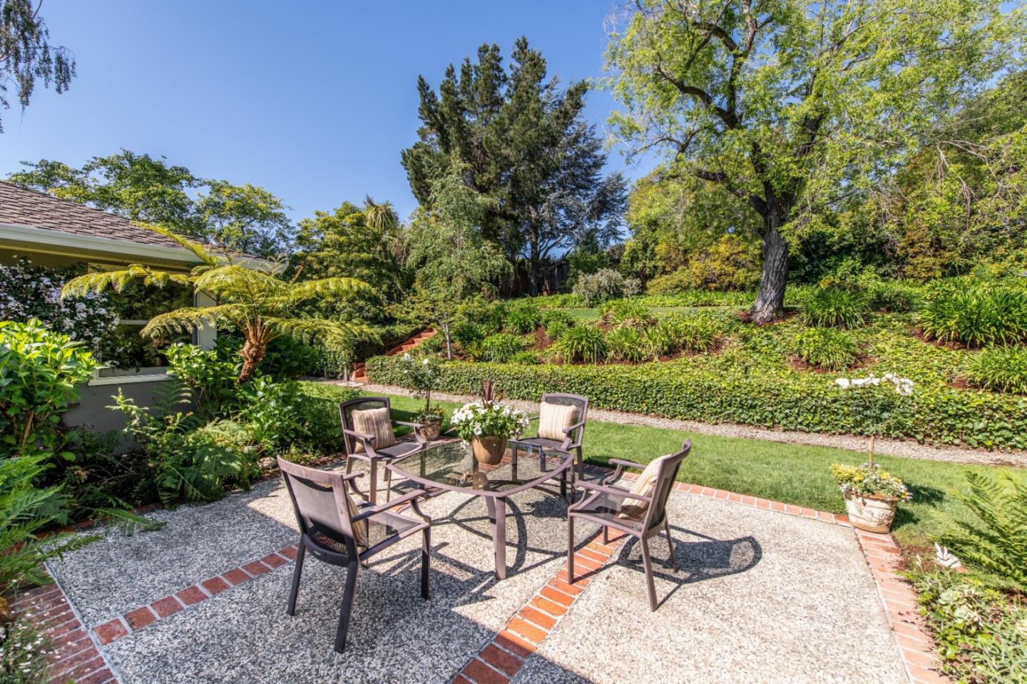 835 Longview Road Hillsborough, CA 94010 - Photo 25 of 31 a view of a chairs and table in the patio