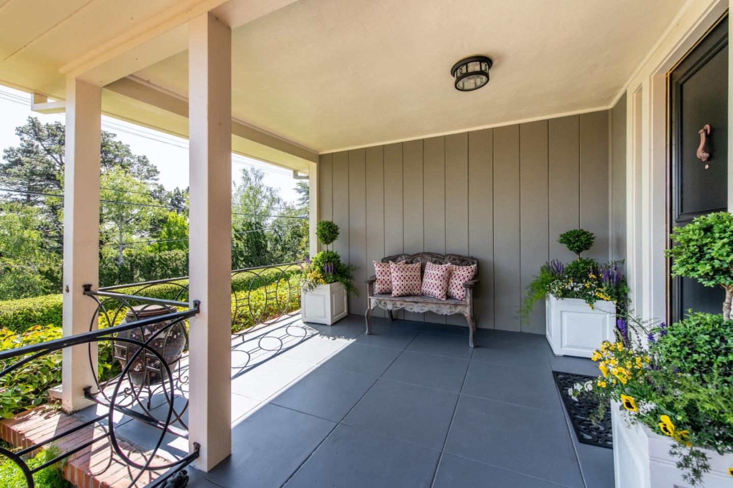835 Longview Road Hillsborough, CA 94010 - Photo 3 of 31 a house with potted plants in front of it