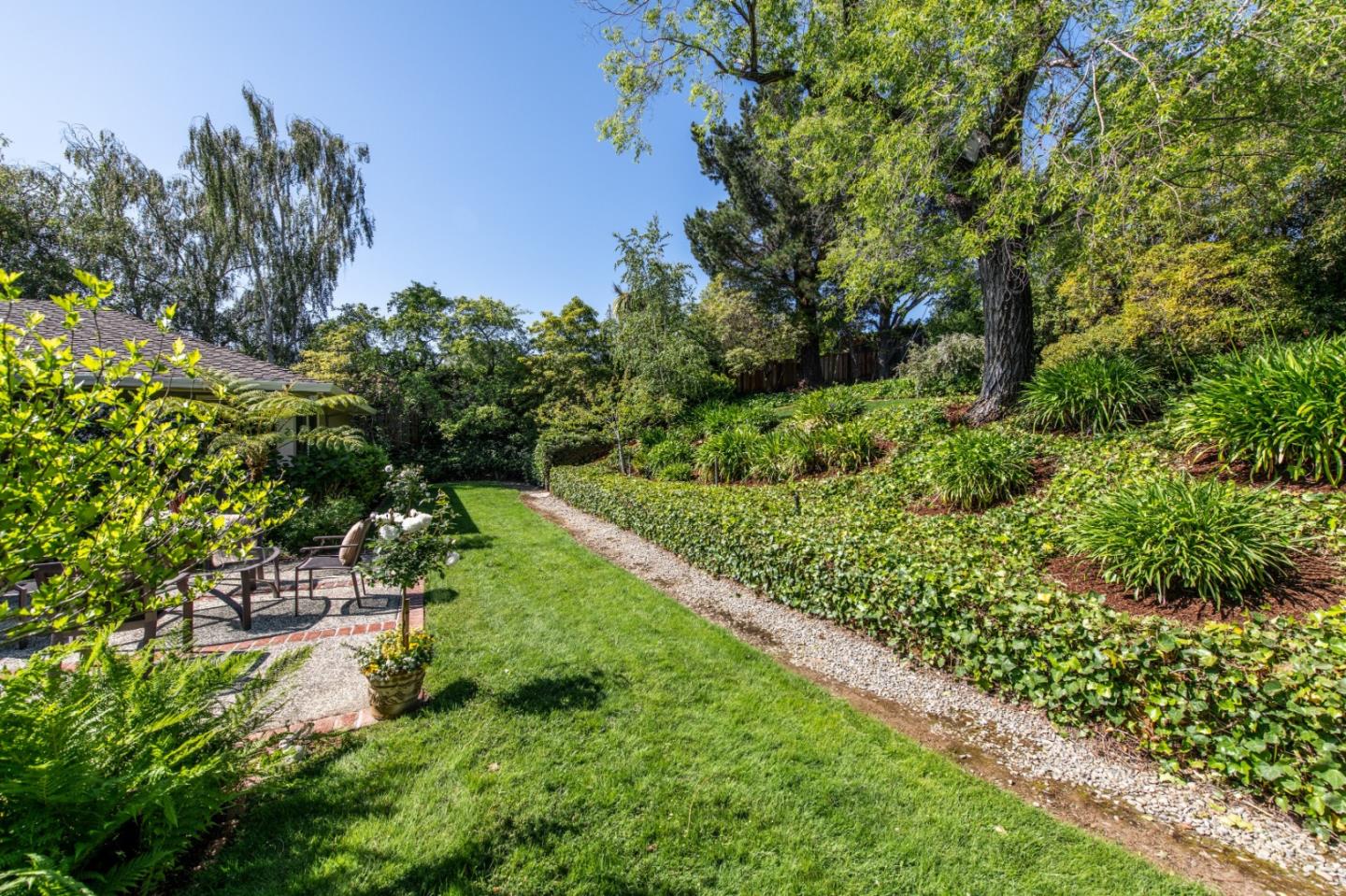 835 Longview Road Hillsborough, CA 94010 - Photo 31 of 31 a backyard of a house with a yard and outdoor seating