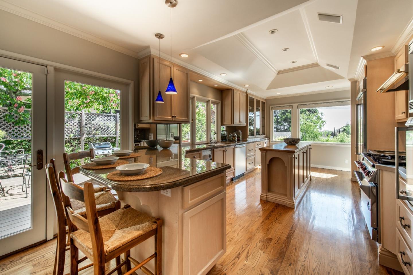 835 Longview Road Hillsborough, CA 94010 - Photo 9 of 31 a kitchen with sink a stove and chairs