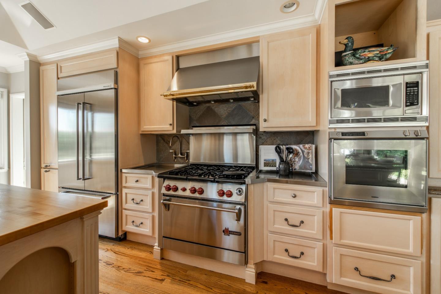 835 Longview Road Hillsborough, CA 94010 - Photo 10 of 31 a kitchen with cabinets and steel stainless steel appliances
