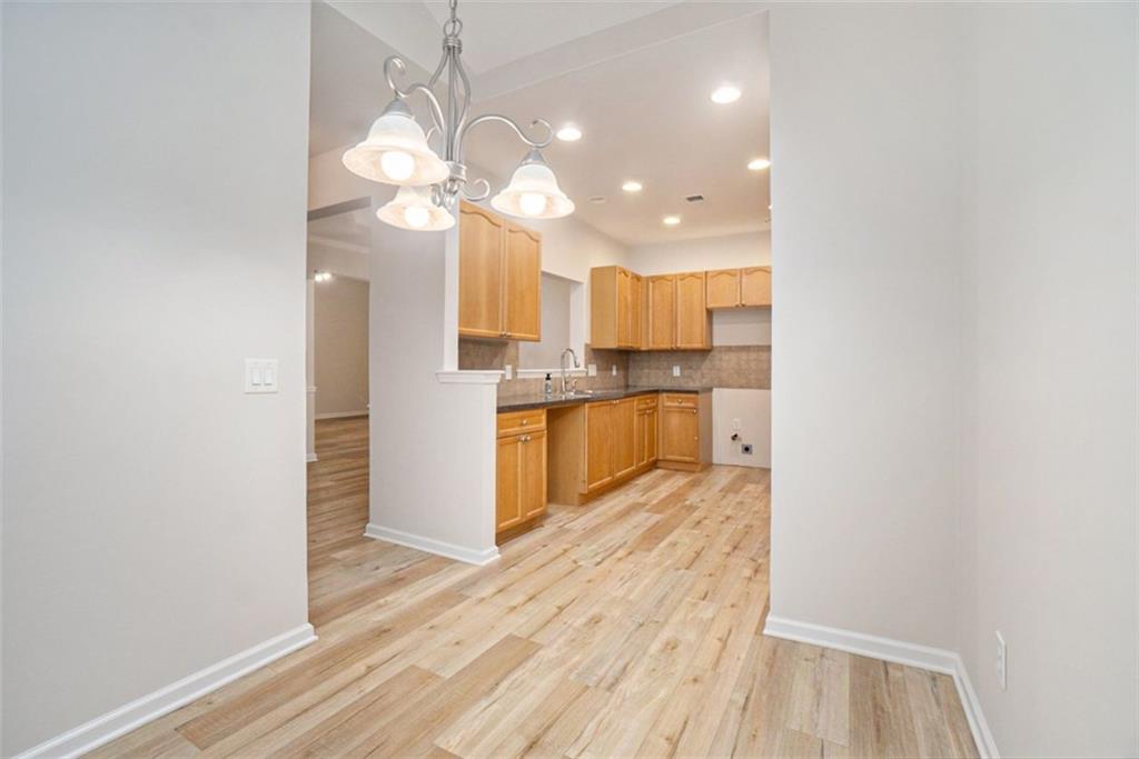 3233 Abbott Drive Southwest, Unit 7 Powder Springs, GA 30127 - Photo 11 of 24 a view of kitchen with wooden floor