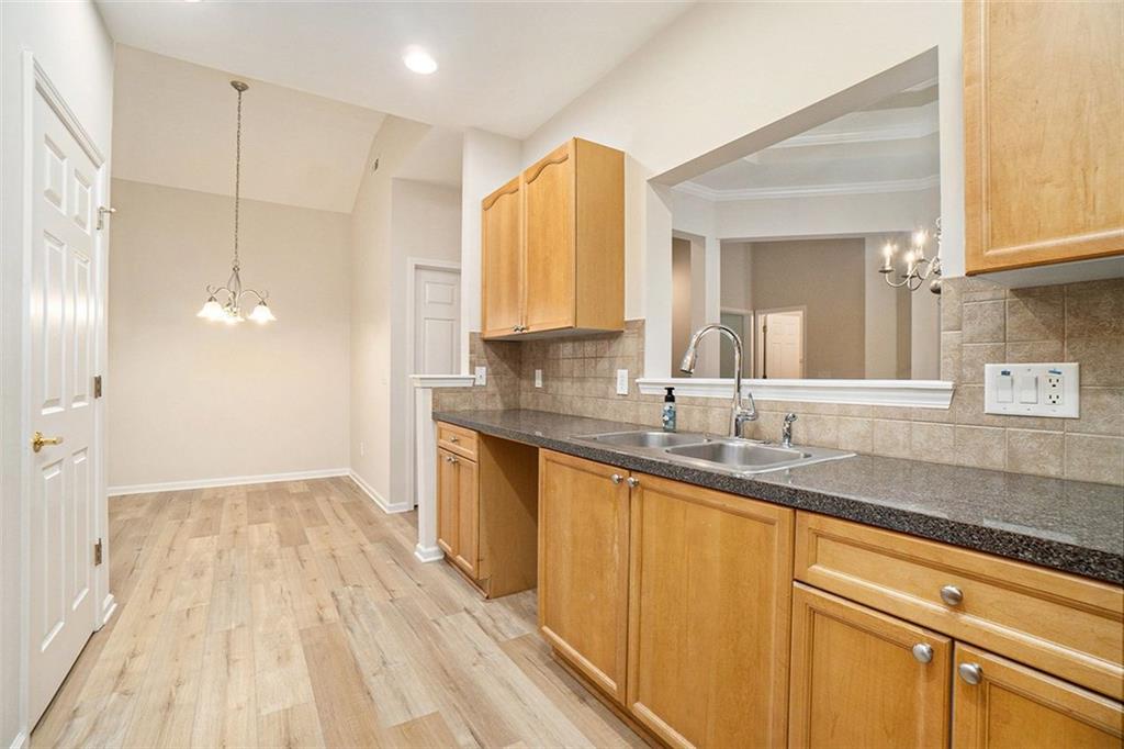 3233 Abbott Drive Southwest, Unit 7 Powder Springs, GA 30127 - Photo 12 of 24 a bathroom with a sink a mirror and a shower