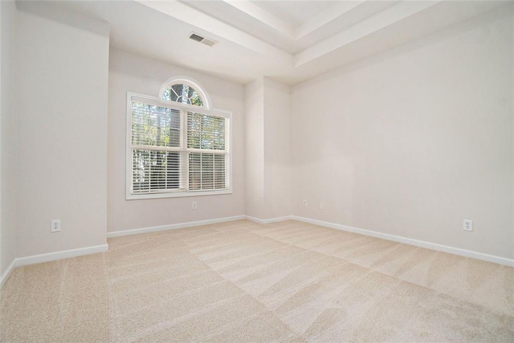 3233 Abbott Drive Southwest, Unit 7 Powder Springs, GA 30127 - Photo 14 of 24 an empty room with windows