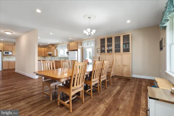 a bedroom with two beds and a window