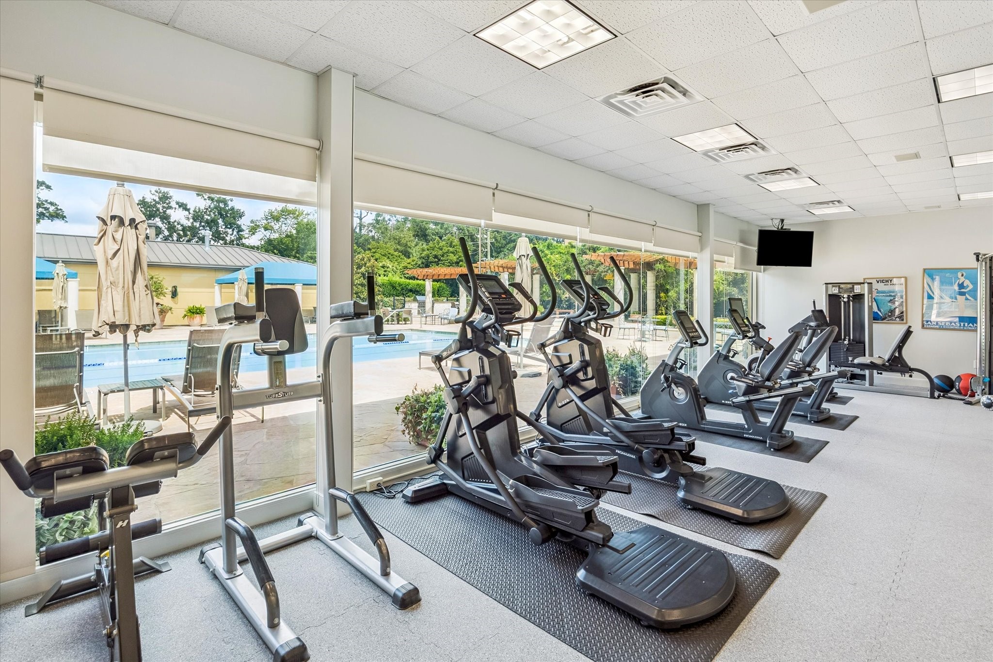 1100 Uptown Park Boulevard, Unit 102 Houston, TX 77056 - Photo 31 of 33 a view of a room with gym equipment