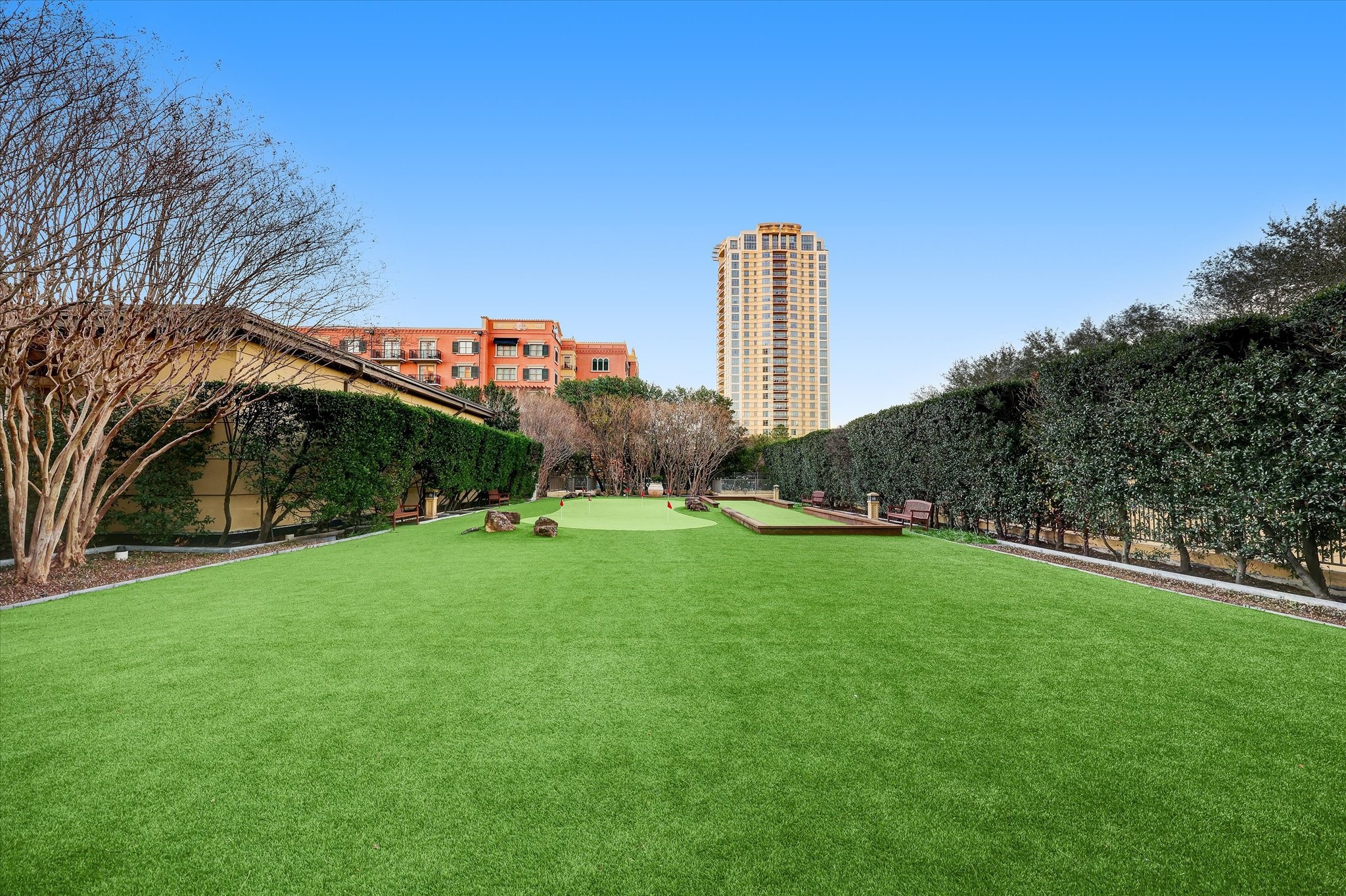 1100 Uptown Park Boulevard, Unit 102 Houston, TX 77056 - Photo 32 of 33 a view of a green field with a house in the background