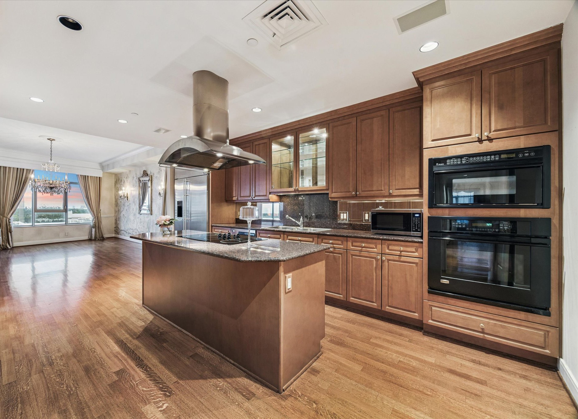 1100 Uptown Park Boulevard, Unit 102 Houston, TX 77056 - Photo 7 of 33 a kitchen with stainless steel appliances granite countertop a stove and cabinets