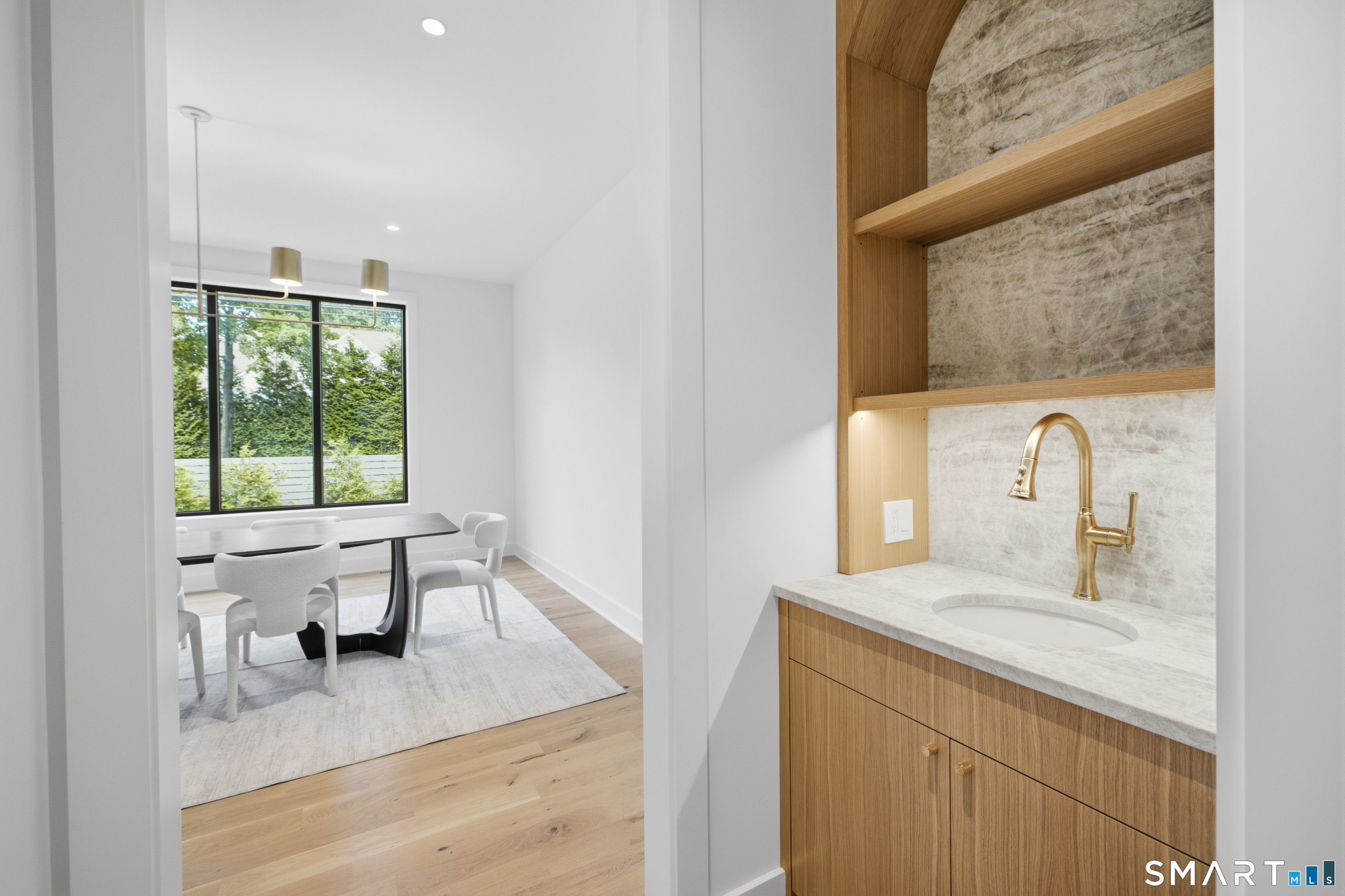 2 Windy Hill Road Westport, CT 06880 - Photo 13 of 40 a bathroom with a granite countertop sink a toilet and a window