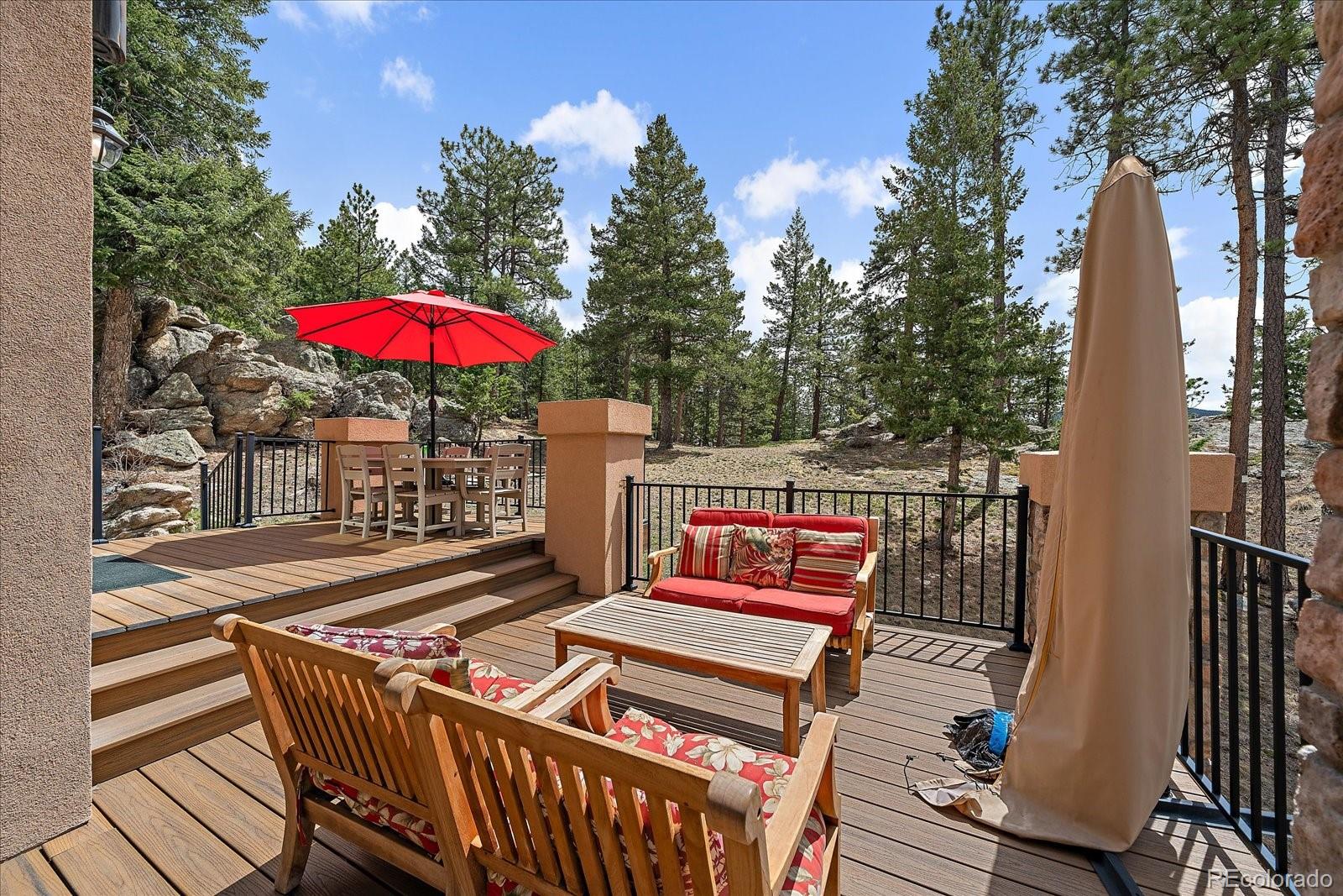 6737 Timbers Drive Evergreen, CO 80439 - Photo 39 of 47 an outdoor view with patio