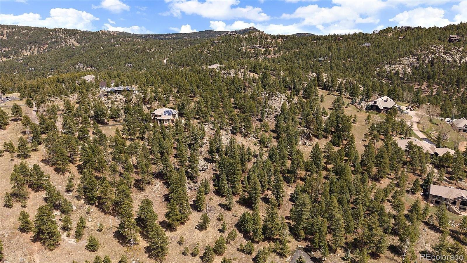 6737 Timbers Drive Evergreen, CO 80439 - Photo 45 of 47 a view of a city with mountains