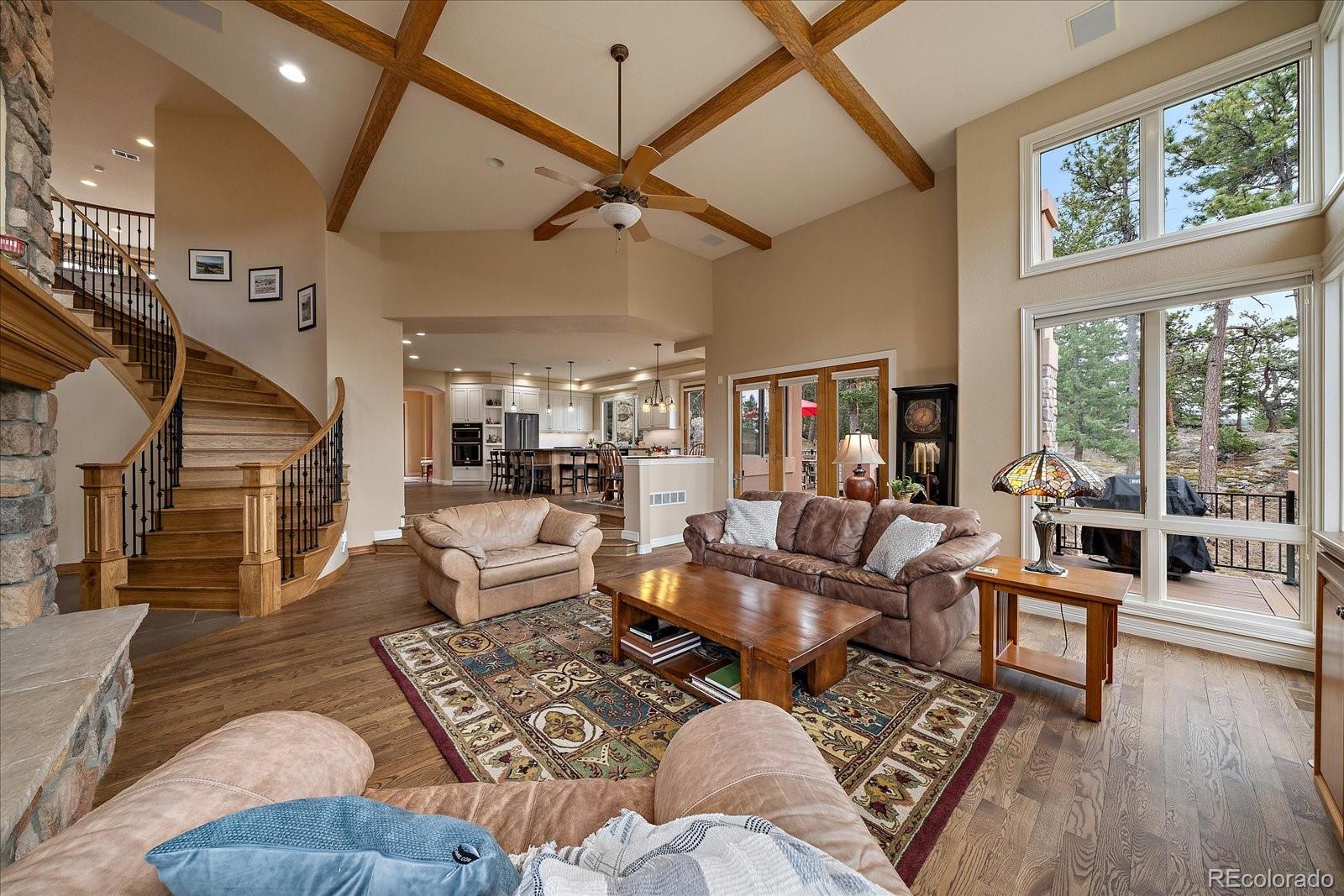 6737 Timbers Drive Evergreen, CO 80439 - Photo 9 of 47 a living room with furniture and a large window