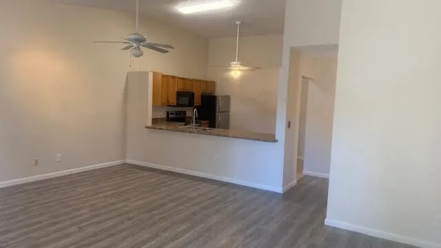 wooden floor in an empty room with a mirror