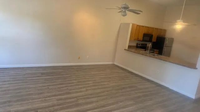 a view of a kitchen from the hallway