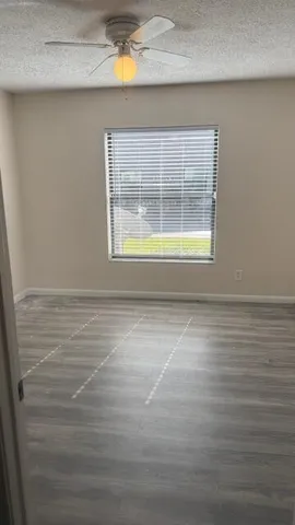 a view of an empty room with a window