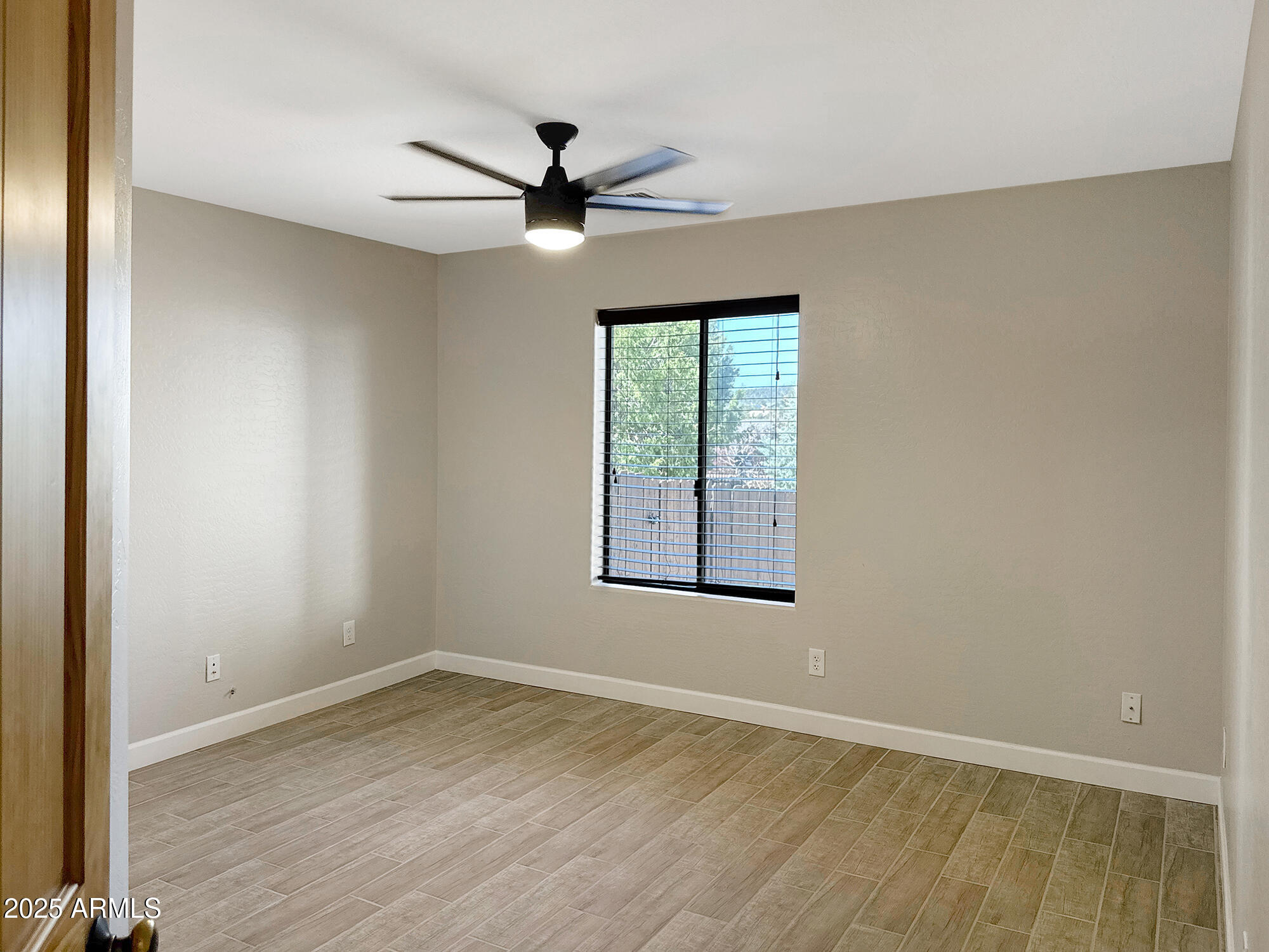 321 South Golden Bear Point Payson, AZ 85541 - Photo 12 of 23 an empty room with wooden floor fan and windows