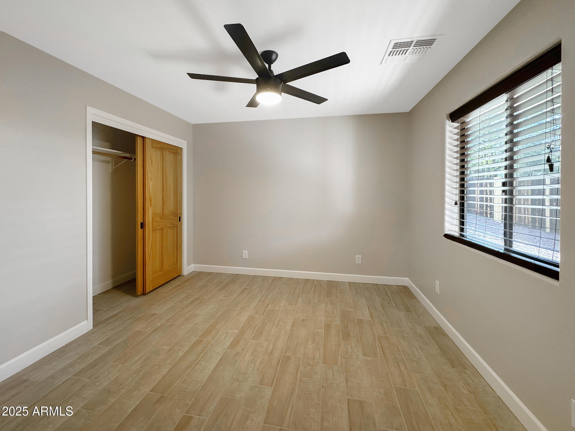 321 South Golden Bear Point Payson, AZ 85541 - Photo 18 of 23 wooden floor in an empty room with a window