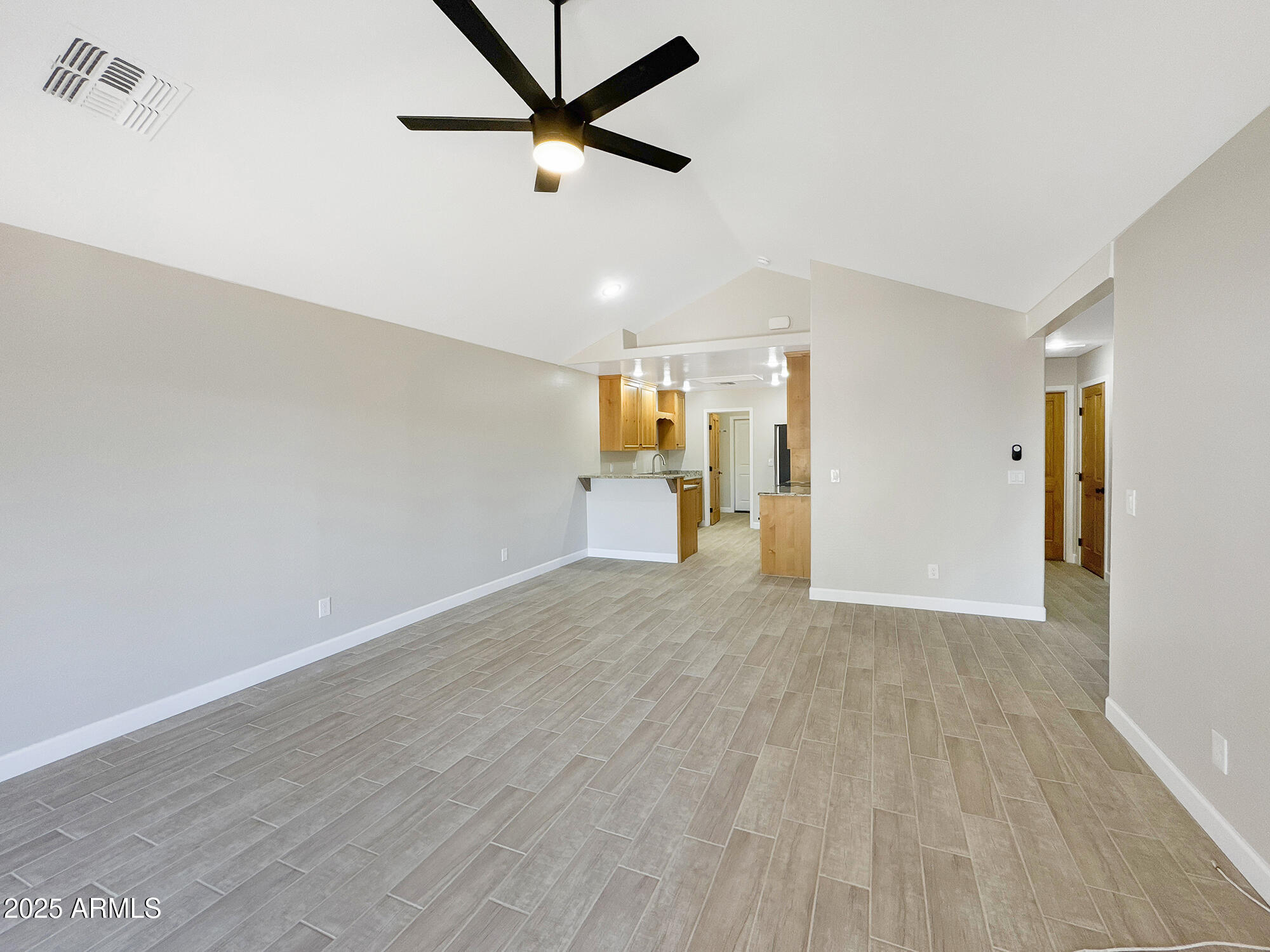 321 South Golden Bear Point Payson, AZ 85541 - Photo 3 of 23 wooden floor in an empty room with a window