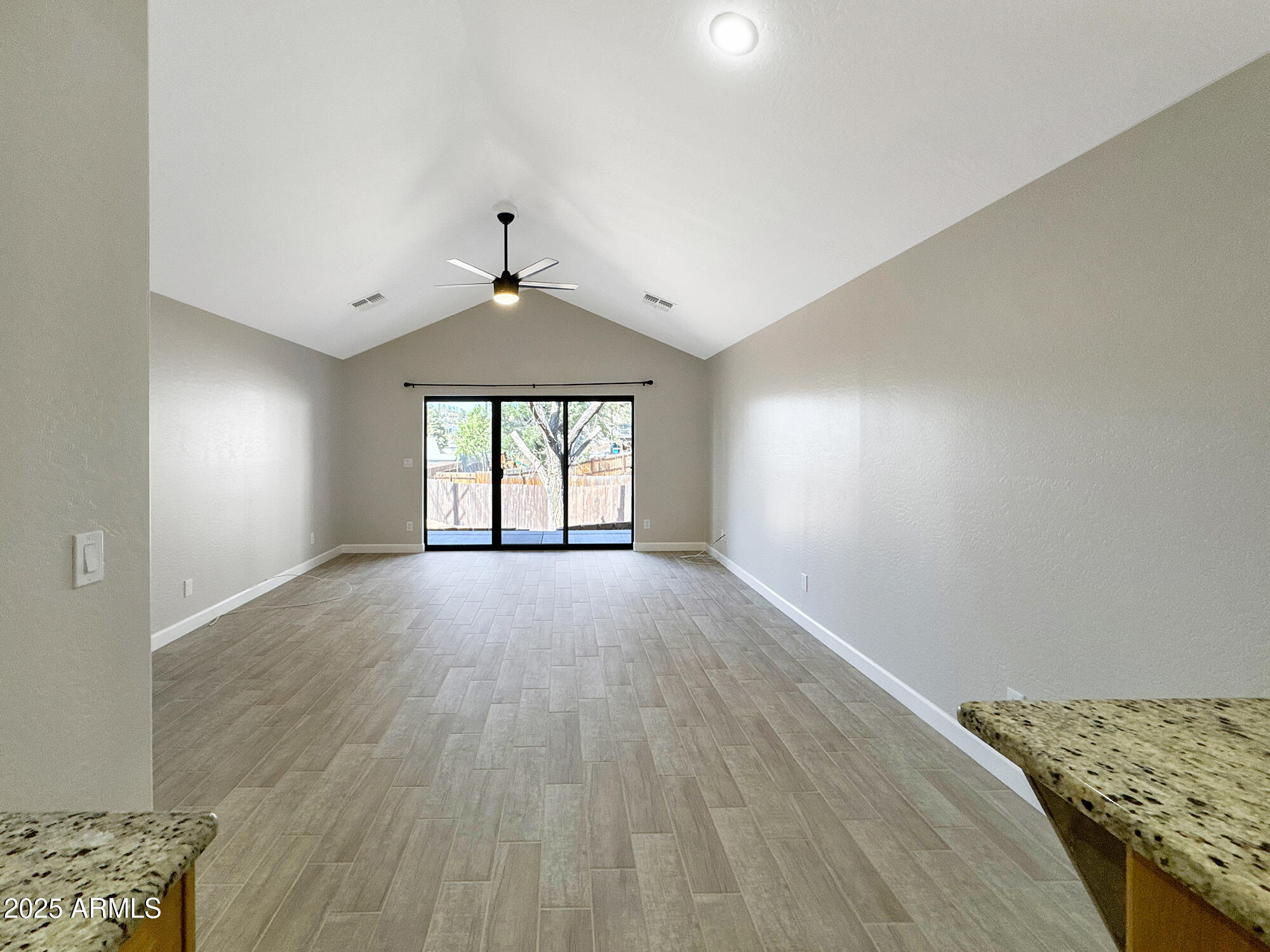 321 South Golden Bear Point Payson, AZ 85541 - Photo 8 of 23 wooden floor in an empty room with a window