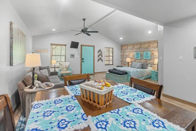 a living room with furniture and a rug