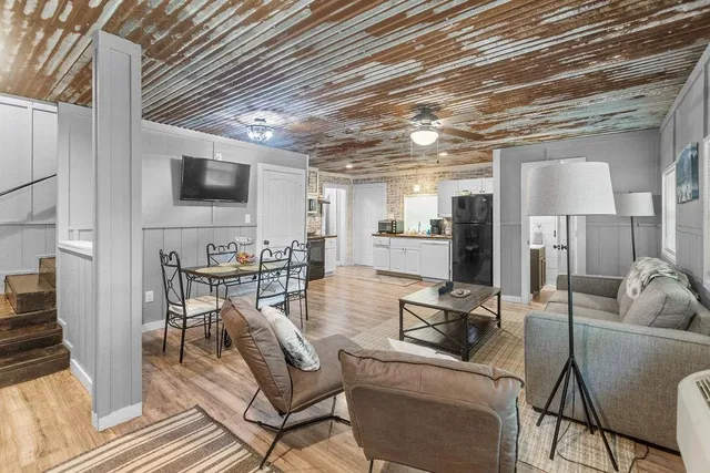 a kitchen with sink stove and refrigerator