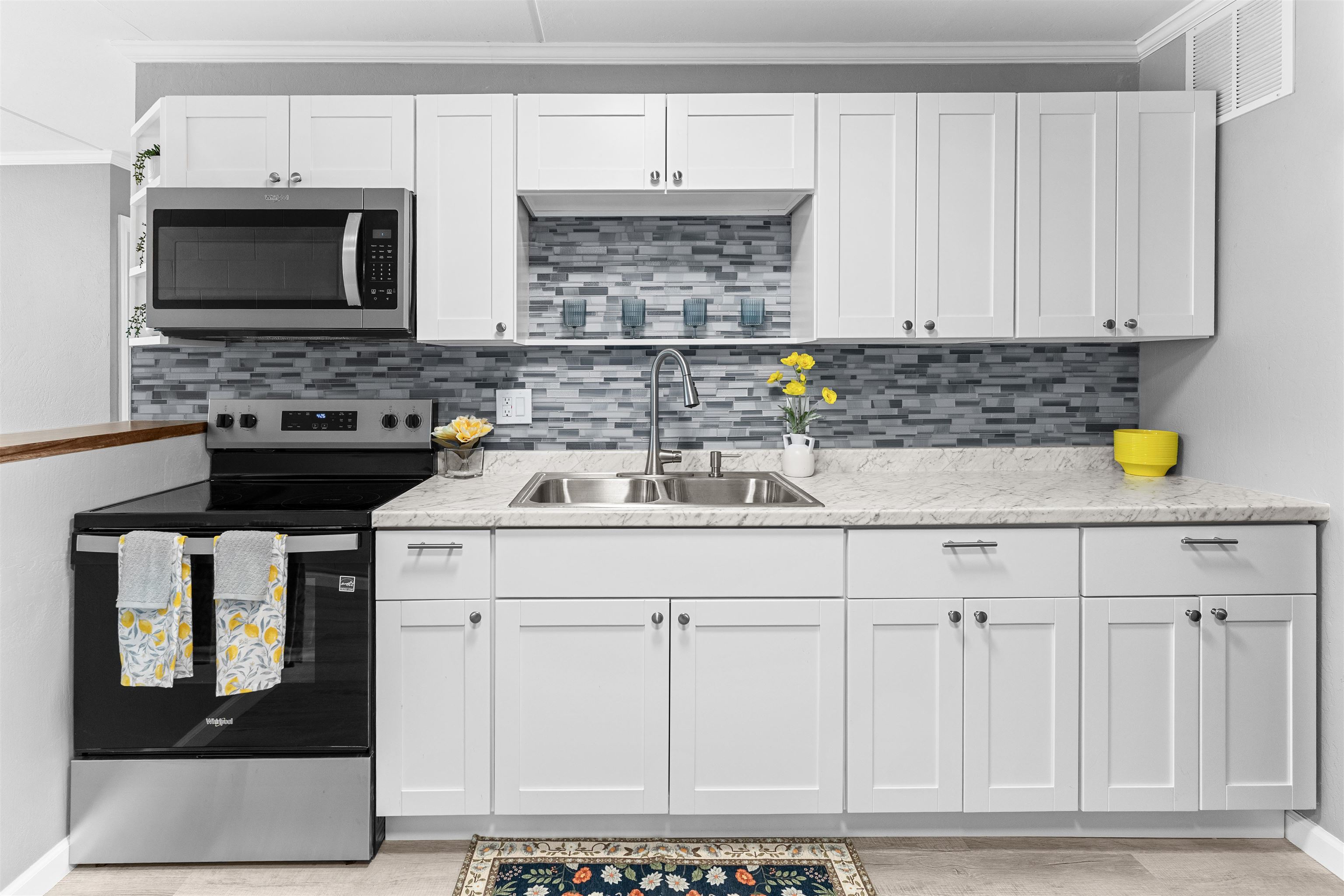 111 Kahului Beach Road, Unit D309 Kahului, HI 96732 - Photo 1 of 26 a kitchen with a sink cabinets and stainless steel appliances