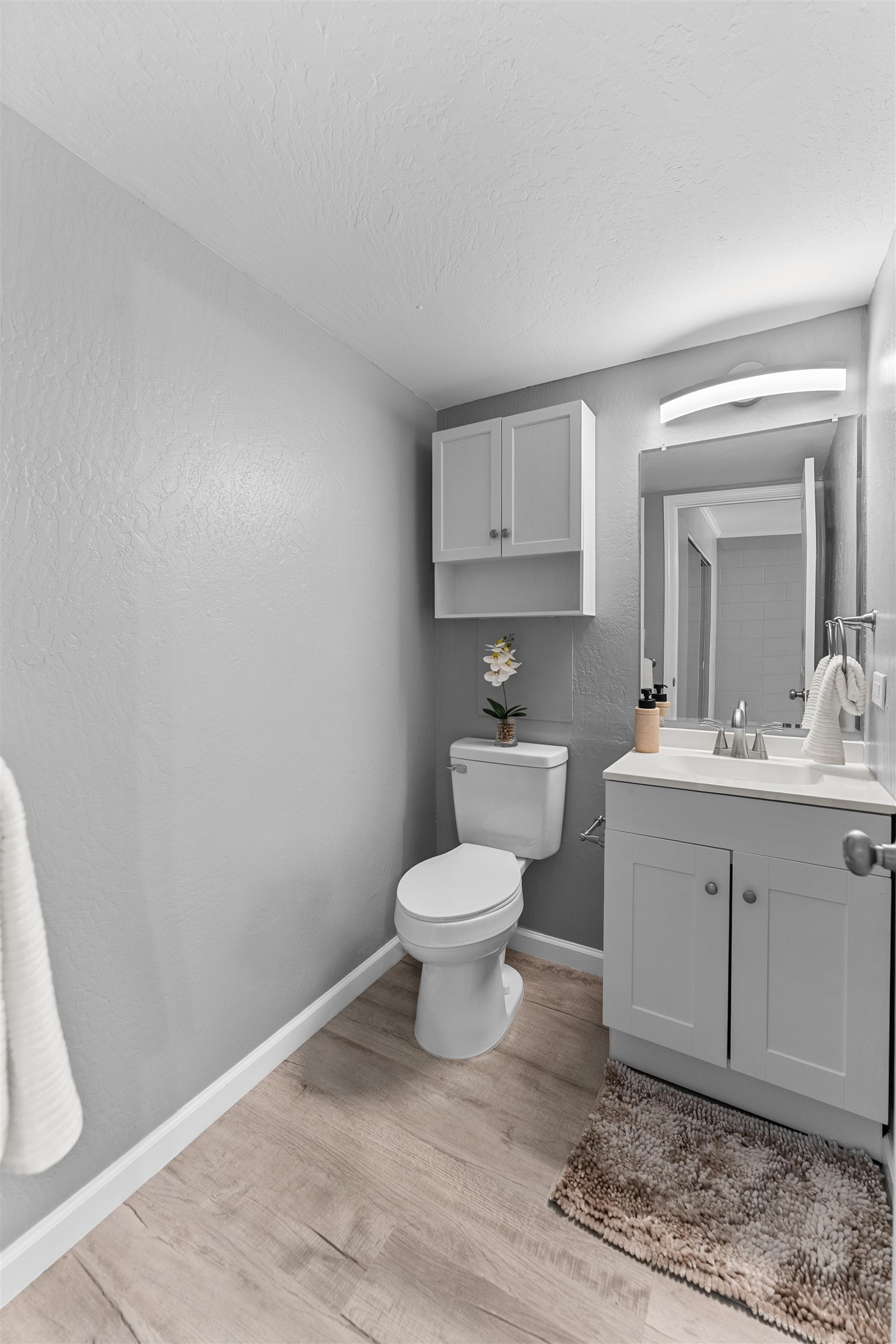 111 Kahului Beach Road, Unit D309 Kahului, HI 96732 - Photo 17 of 26 a bathroom with a toilet a sink and mirror