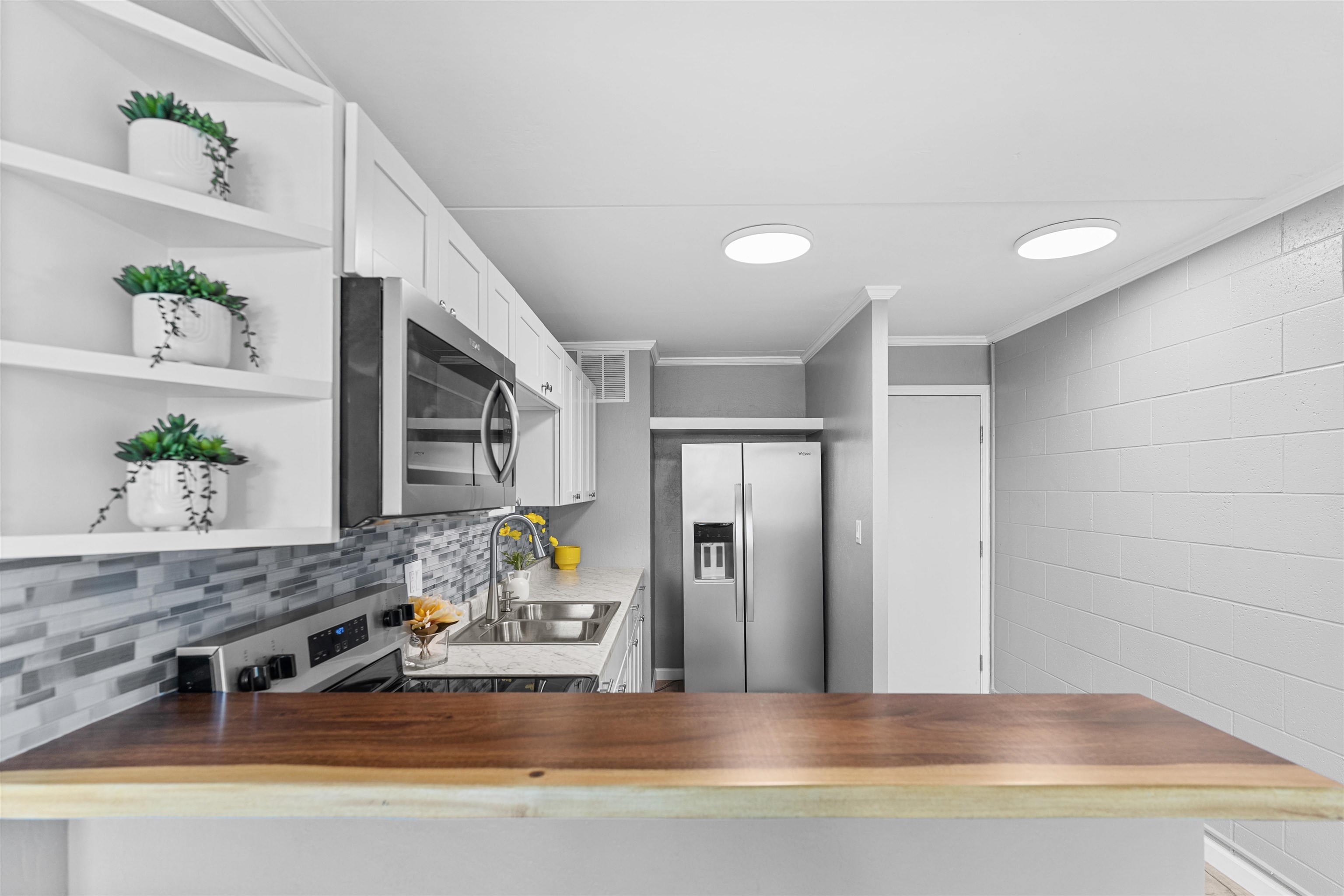 111 Kahului Beach Road, Unit D309 Kahului, HI 96732 - Photo 3 of 26 a living room with furniture and wooden floor