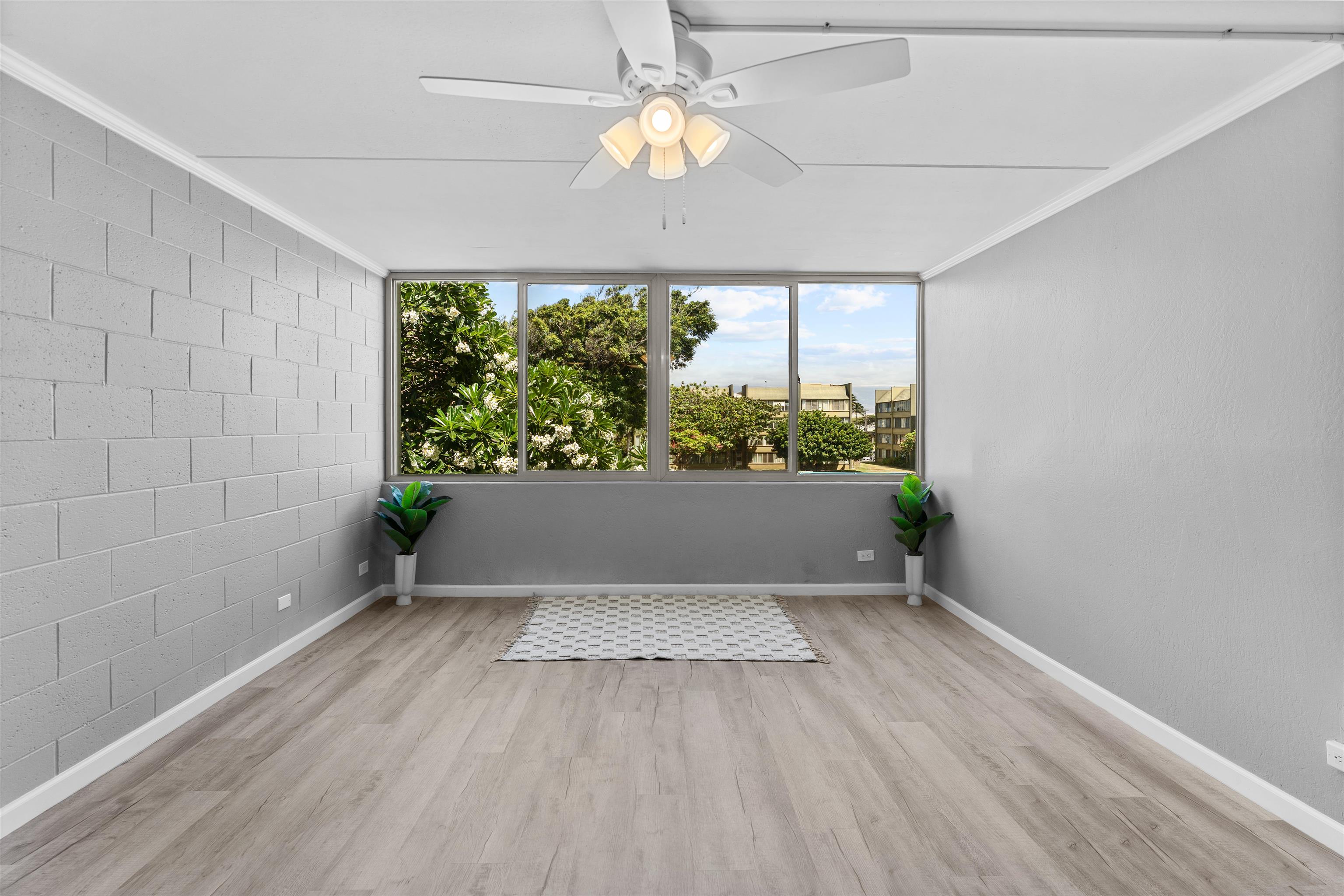 111 Kahului Beach Road, Unit D309 Kahului, HI 96732 - Photo 7 of 26 wooden floor in an empty room with a window