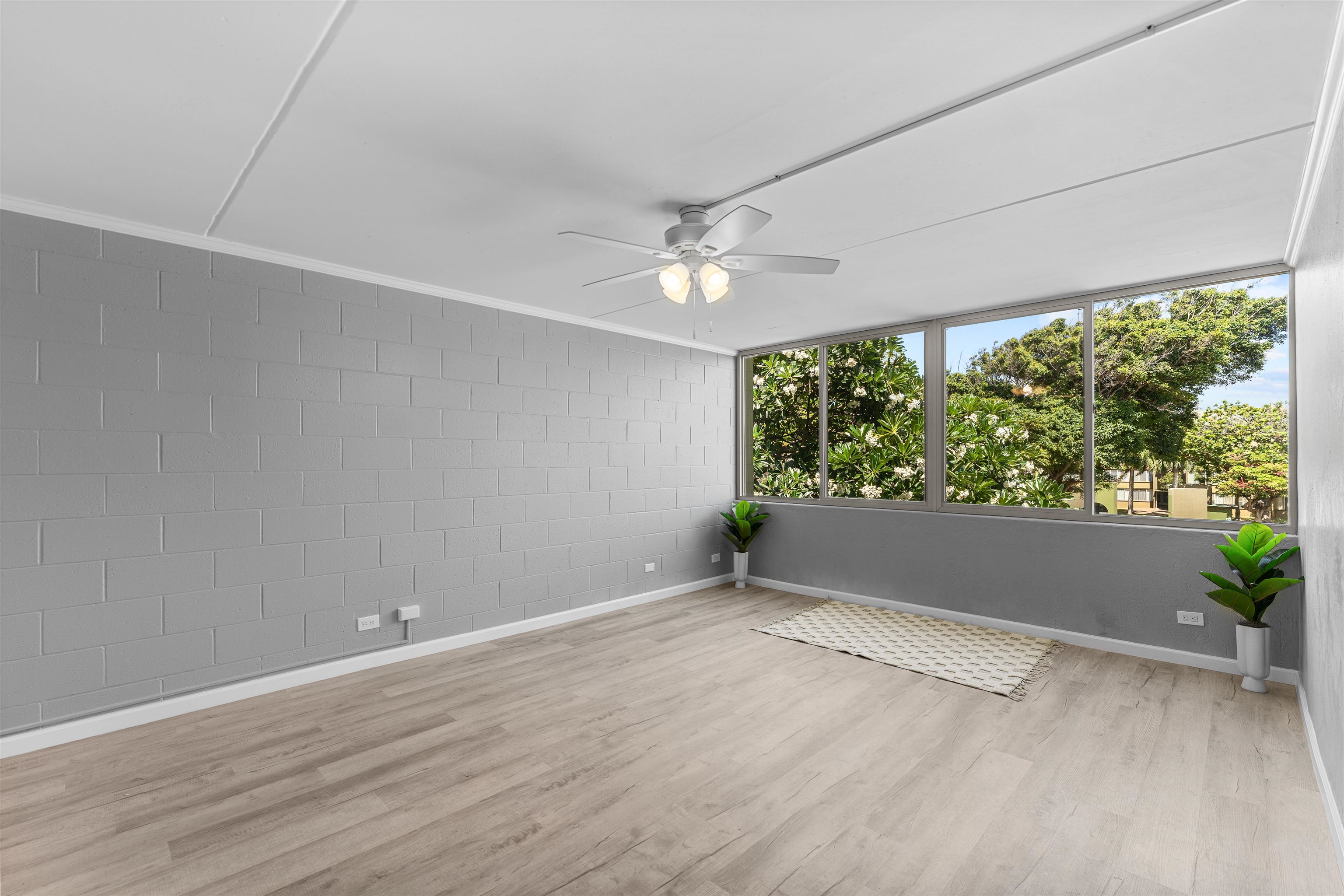 111 Kahului Beach Road, Unit D309 Kahului, HI 96732 - Photo 8 of 26 an empty room with wooden floor and windows