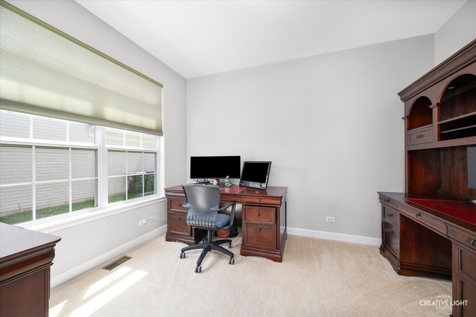 5912 Mackinac Lane Hoffman Estates, IL 60192 - Photo 14 of 32 a view of a workspace with furniture and a window