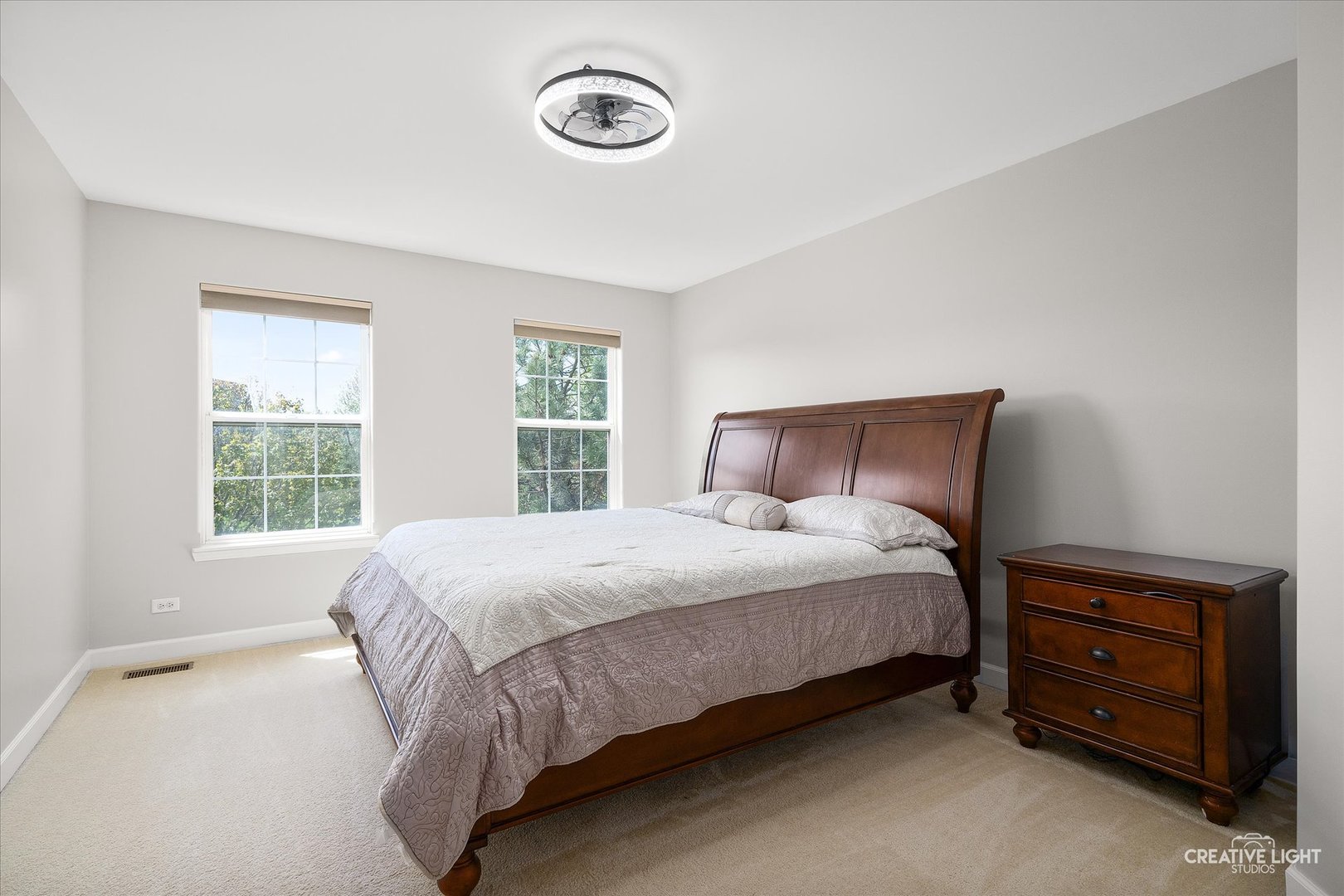 5912 Mackinac Lane Hoffman Estates, IL 60192 - Photo 15 of 32 a large bed sitting in a bedroom next to a window