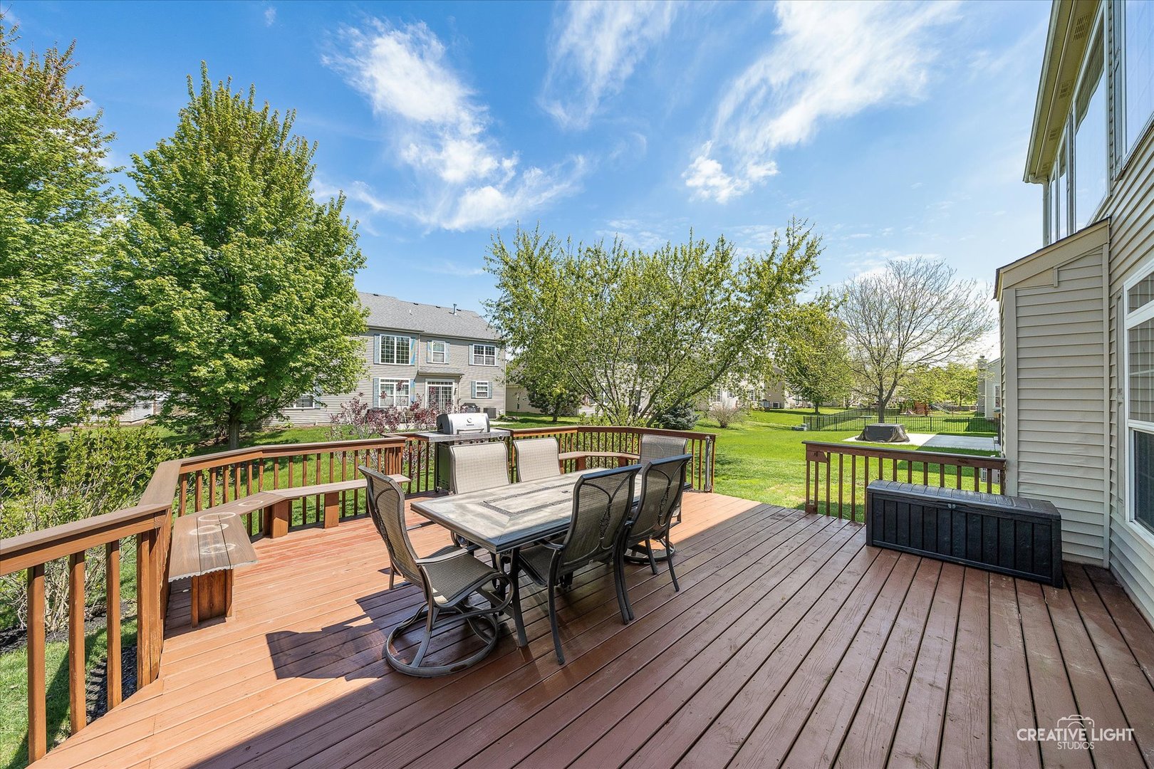 5912 Mackinac Lane Hoffman Estates, IL 60192 - Photo 27 of 32 a view of a deck with furniture and trees