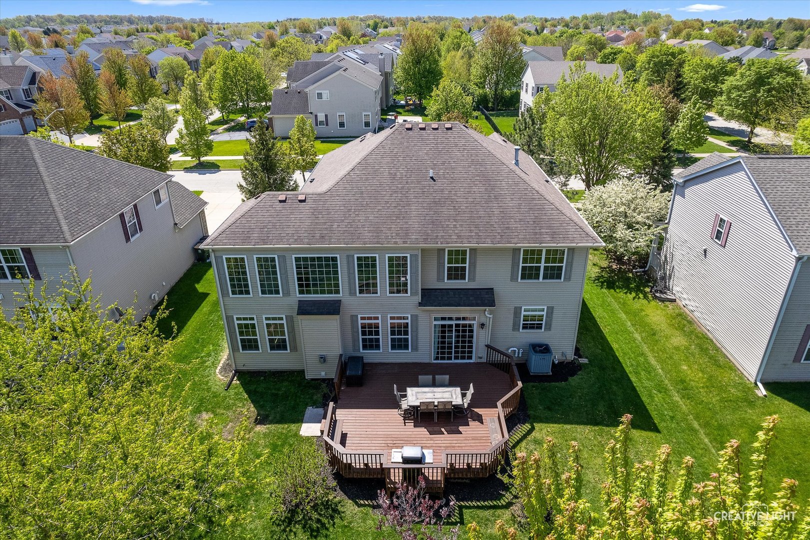 5912 Mackinac Lane Hoffman Estates, IL 60192 - Photo 31 of 32 an aerial view of a house with garden space and a patio